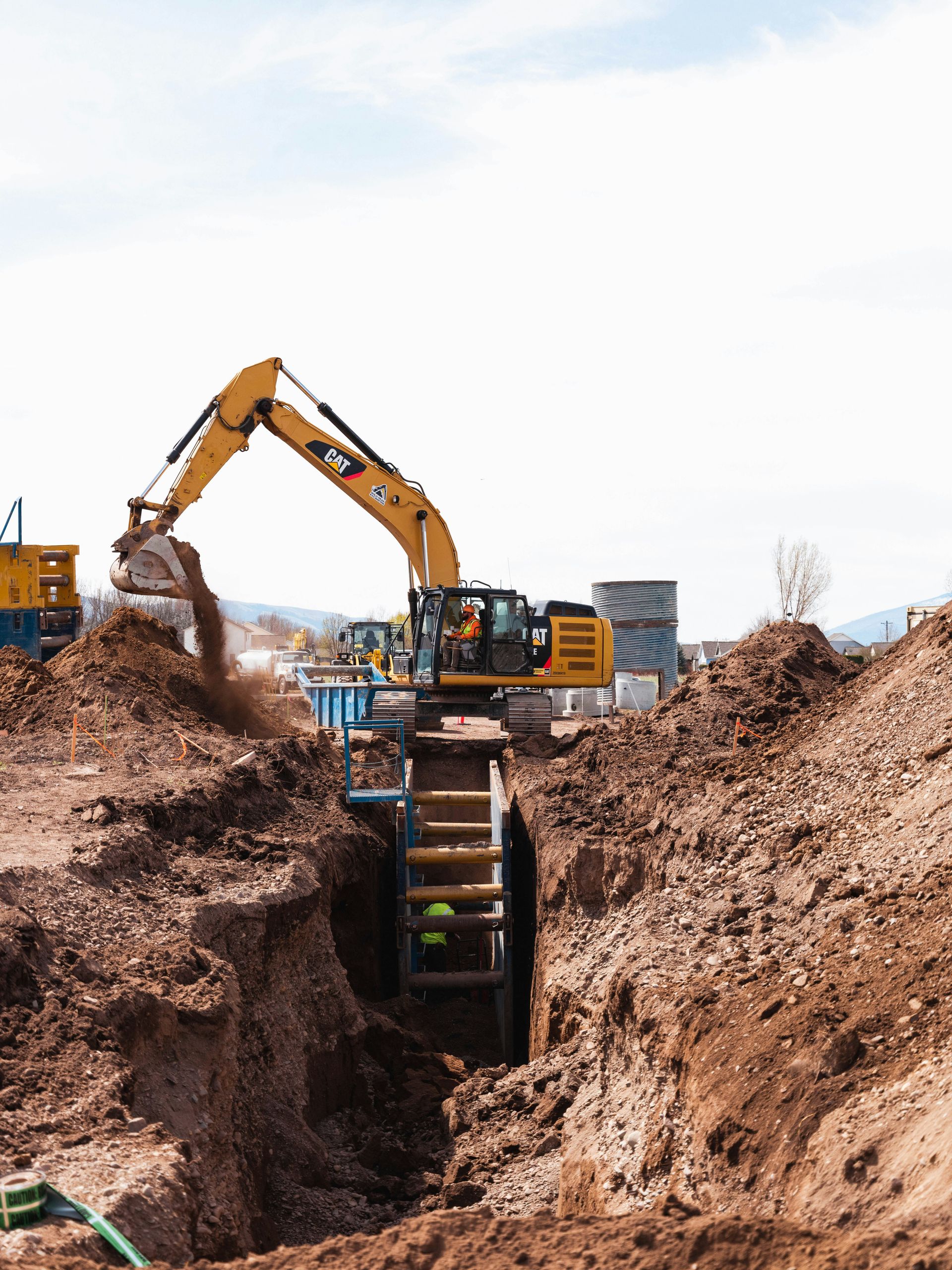 a construction vehicle in a dirt field